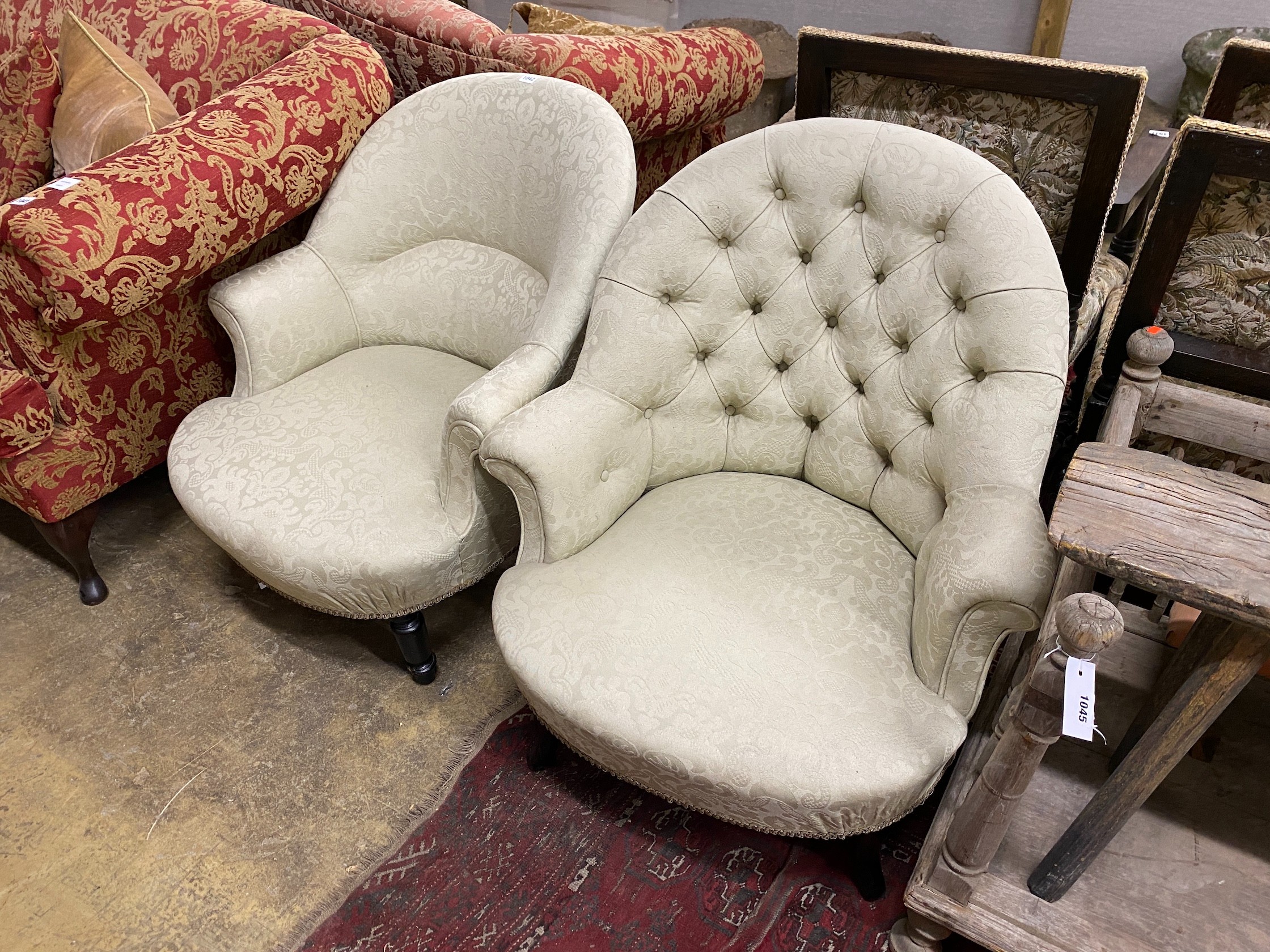 Two late Victorian ebonised tub framed chairs with natural fabric loose covers